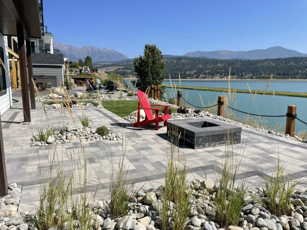 Fire pit terrace with red chairs and lake views