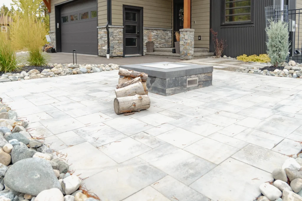 Tofino Grey paver court with natural gas fireplace