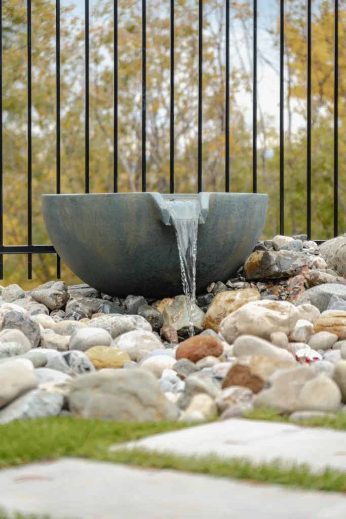 Aquascapes spillway bowl set among round river rock