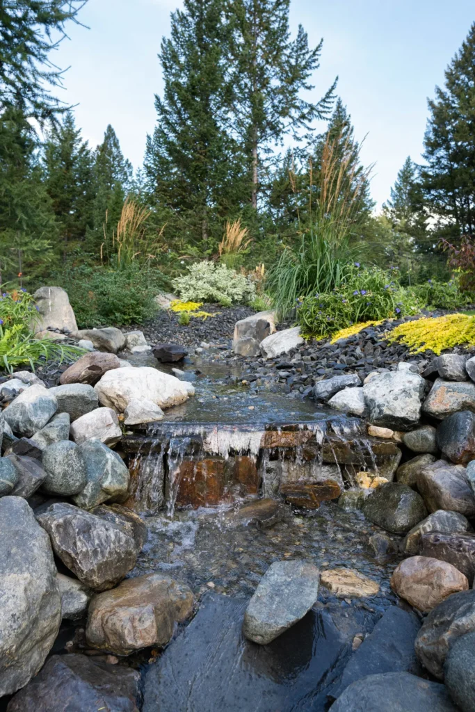 Shallow stream cascade surrounded by natural stone