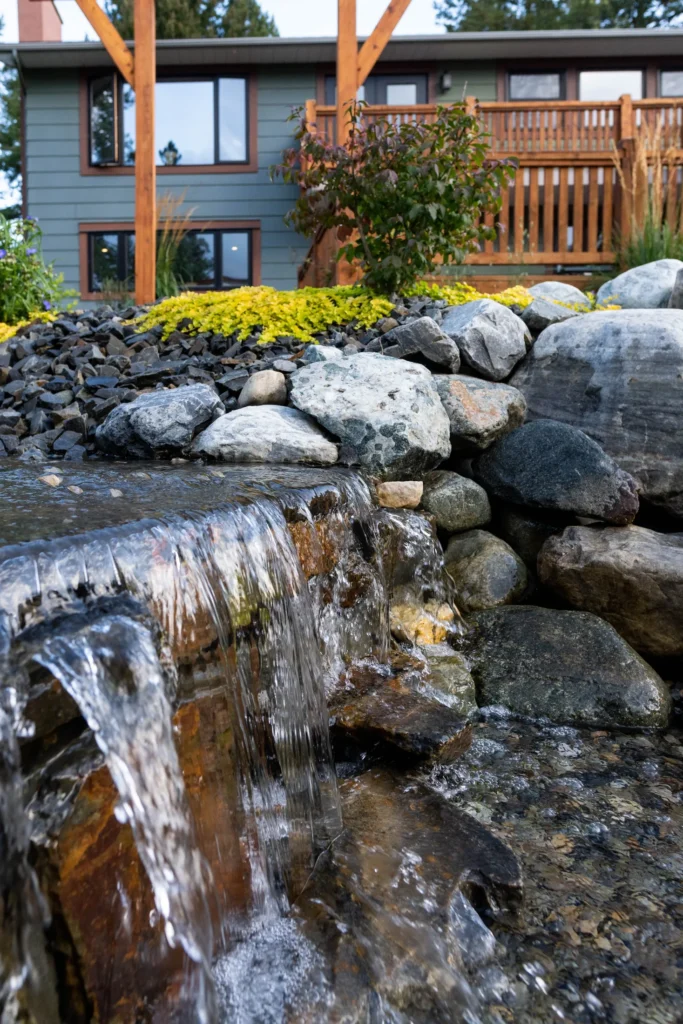 Close view of water moving over dark stone