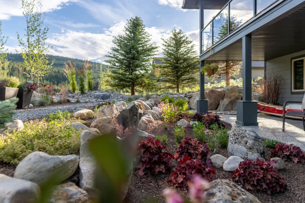 Covered sitting area beside colourful naturalistic planting
