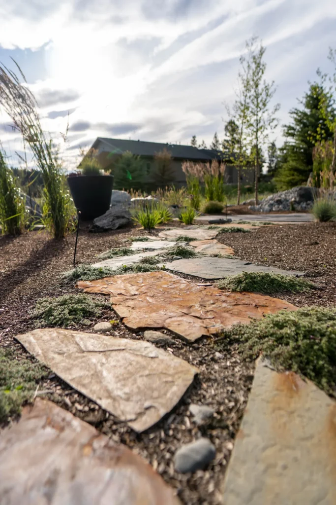 Natural flagstone path woven through low groundcover