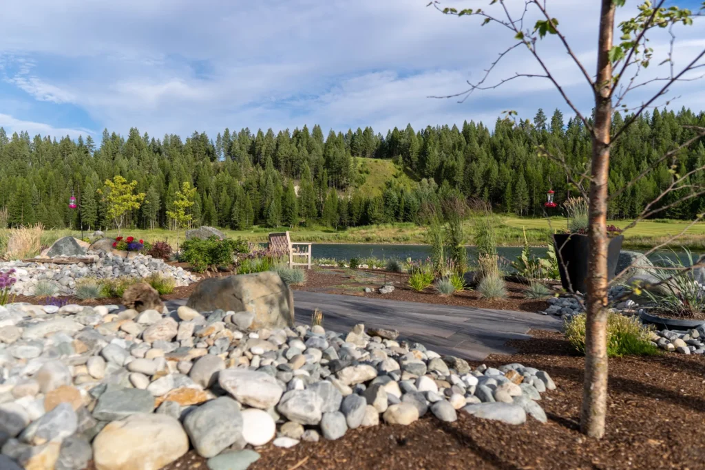 Rock garden and layered planting opening to a distant view