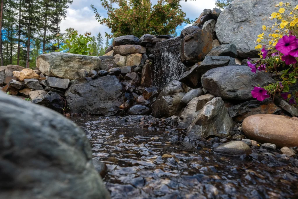 Water cascading between large natural boulders