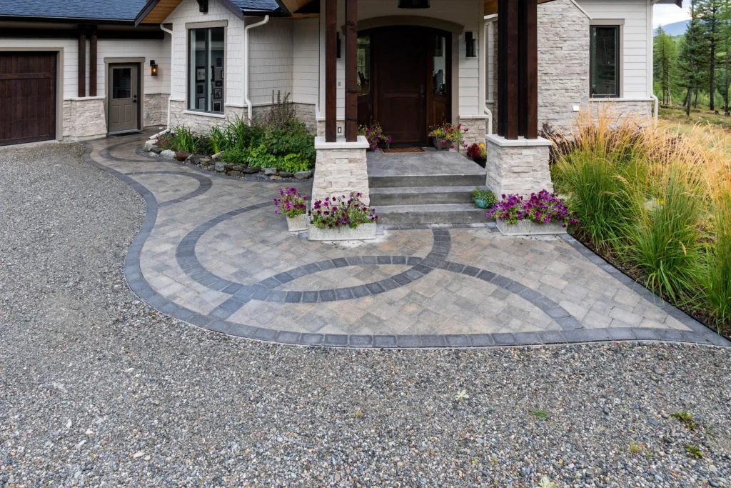 Circular paving stone inlay defining the front entrance