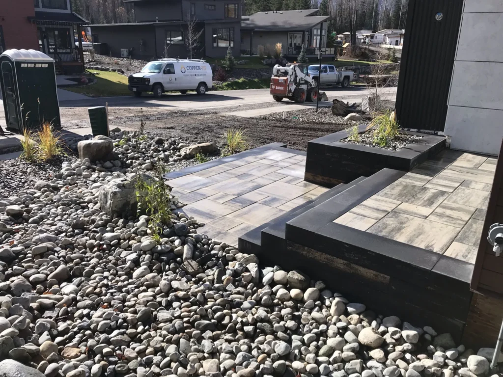Built-in planter anchoring the modern front patio