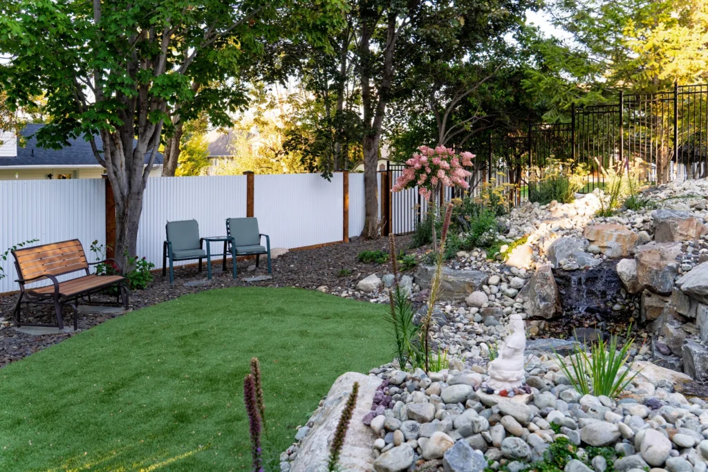 Artificial turf yoga and meditation area beside the stream with garden seating